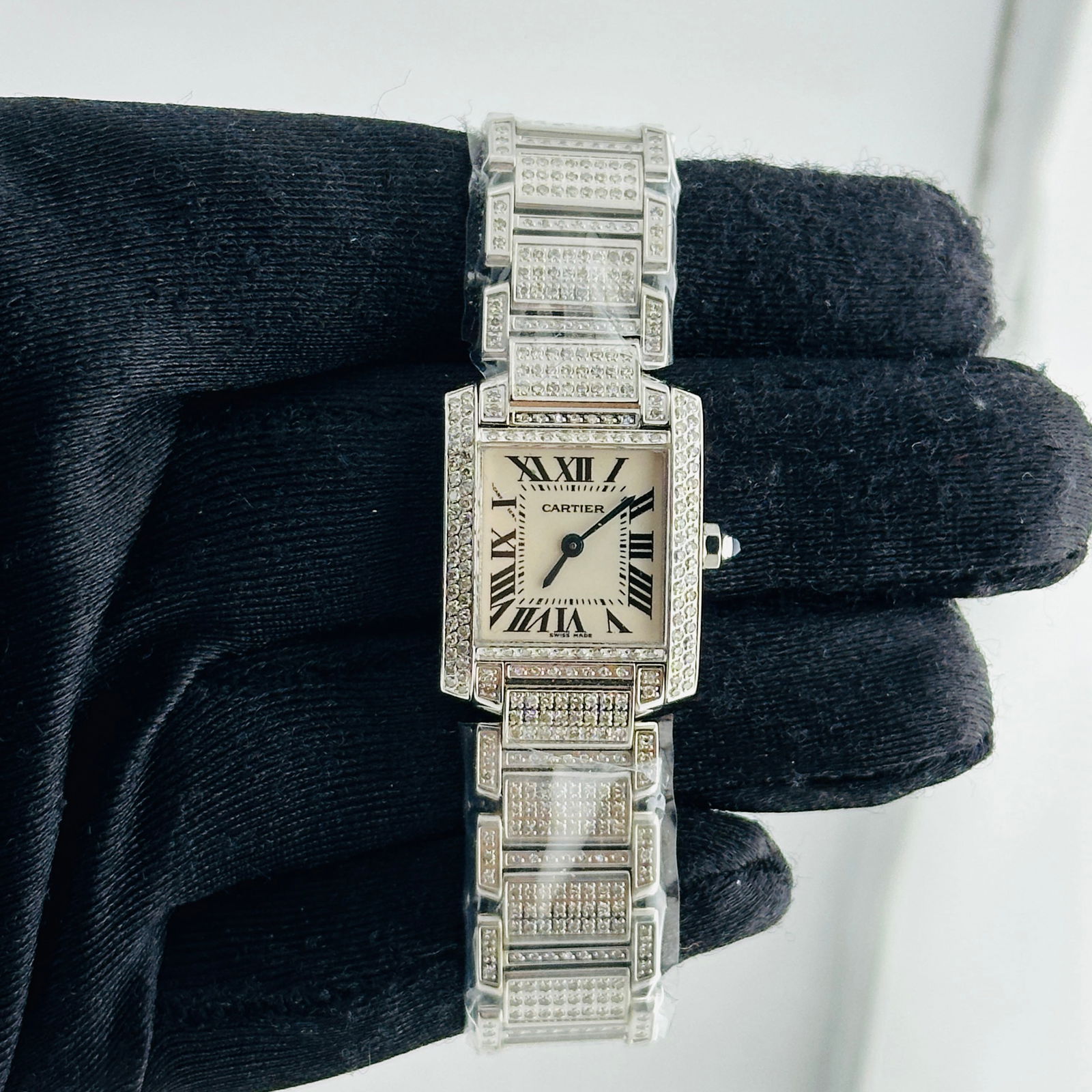 Ladies Cartier Tank Francaise Diamond Bezel and Bracelet Watch Reference 2384: Ladies Cartier Tank Francaise Diamond Bezel and Bracelet Watch Reference 2384 This Cartier Tank Francaise watch features a white dial, a diamond bezel, and a diamond bracelet. It is designed for ladie