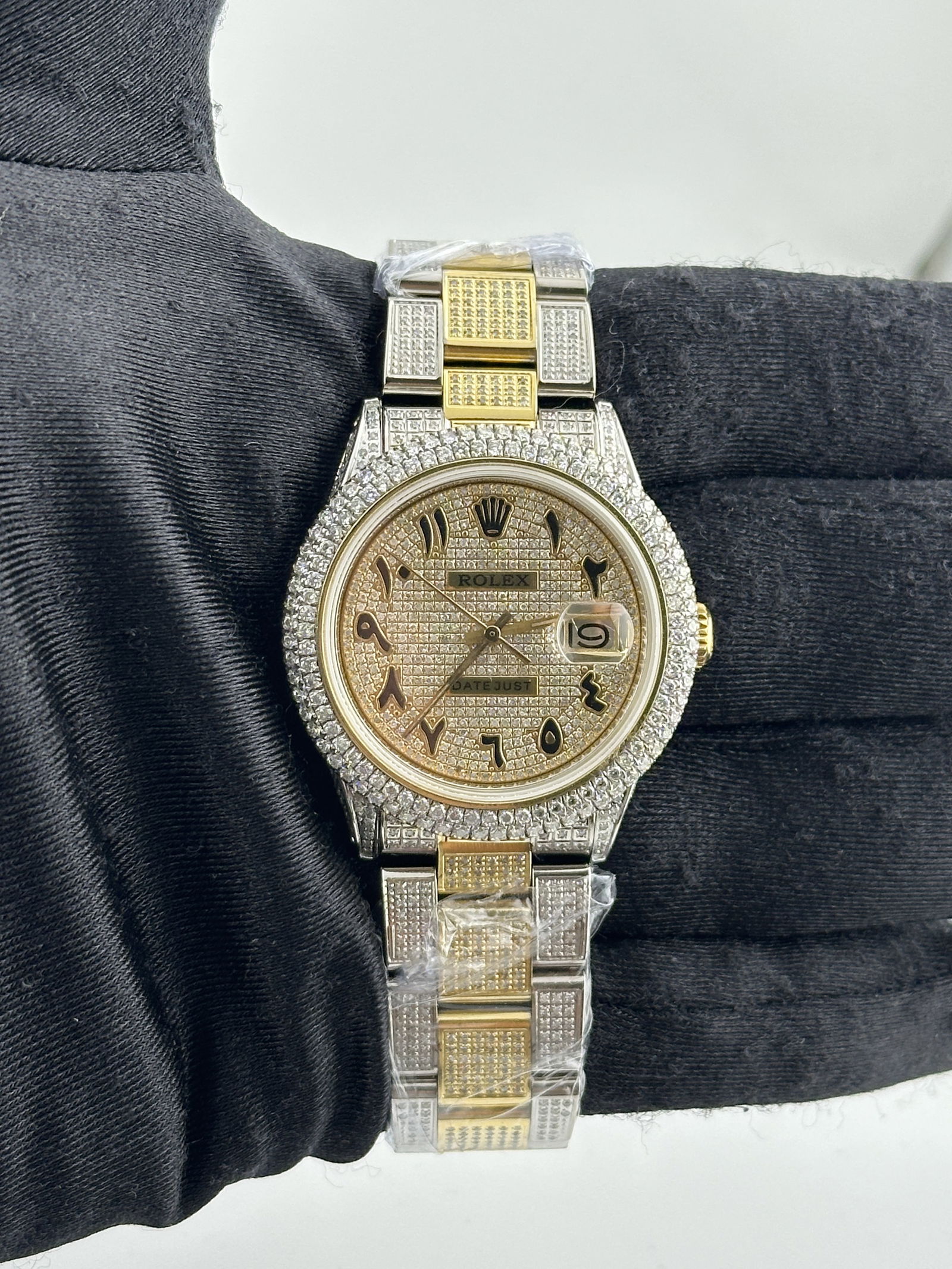 Diamond Arabic Dial Rolex Datejust 1601 with Aftermarket Diamond Oyster Bracelet: Diamond Arabic Dial Rolex Datejust 1601 with Aftermarket Diamond Oyster Bracelet This men's Rolex Datejust features a diamond Arabic dial, a two-row diamond bezel, and an aftermarket diamond Oyster br