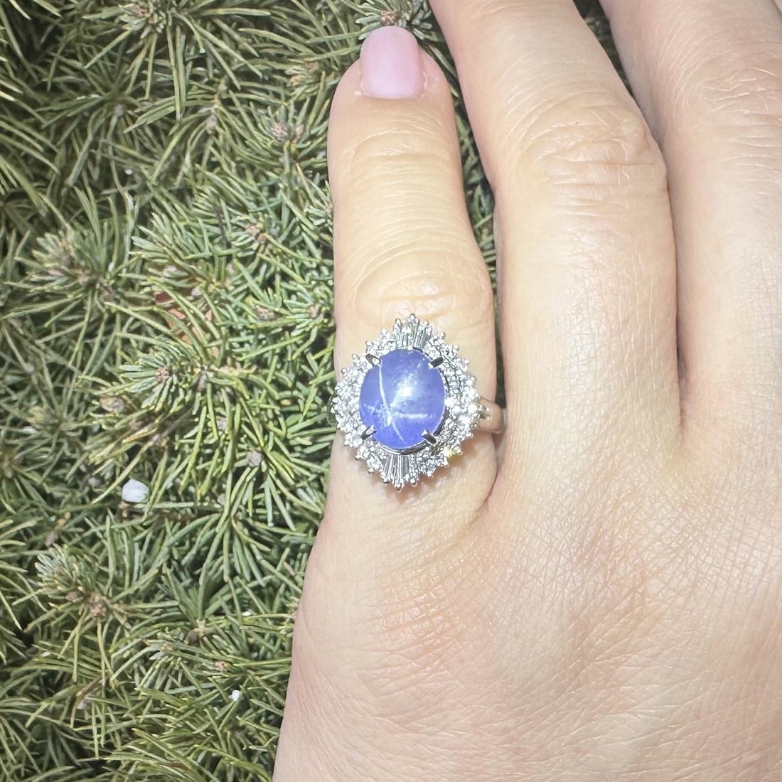 6.79ct Star Sapphire and Diamond Cabochon Ring in Platinum: 6.79ct Star Sapphire and Diamond Cabochon Ring in Platinum This exquisite cocktail ring features a natural, untreated star sapphire with a sharp blue color in an oval cabochon cut, weighing 6.13 carat