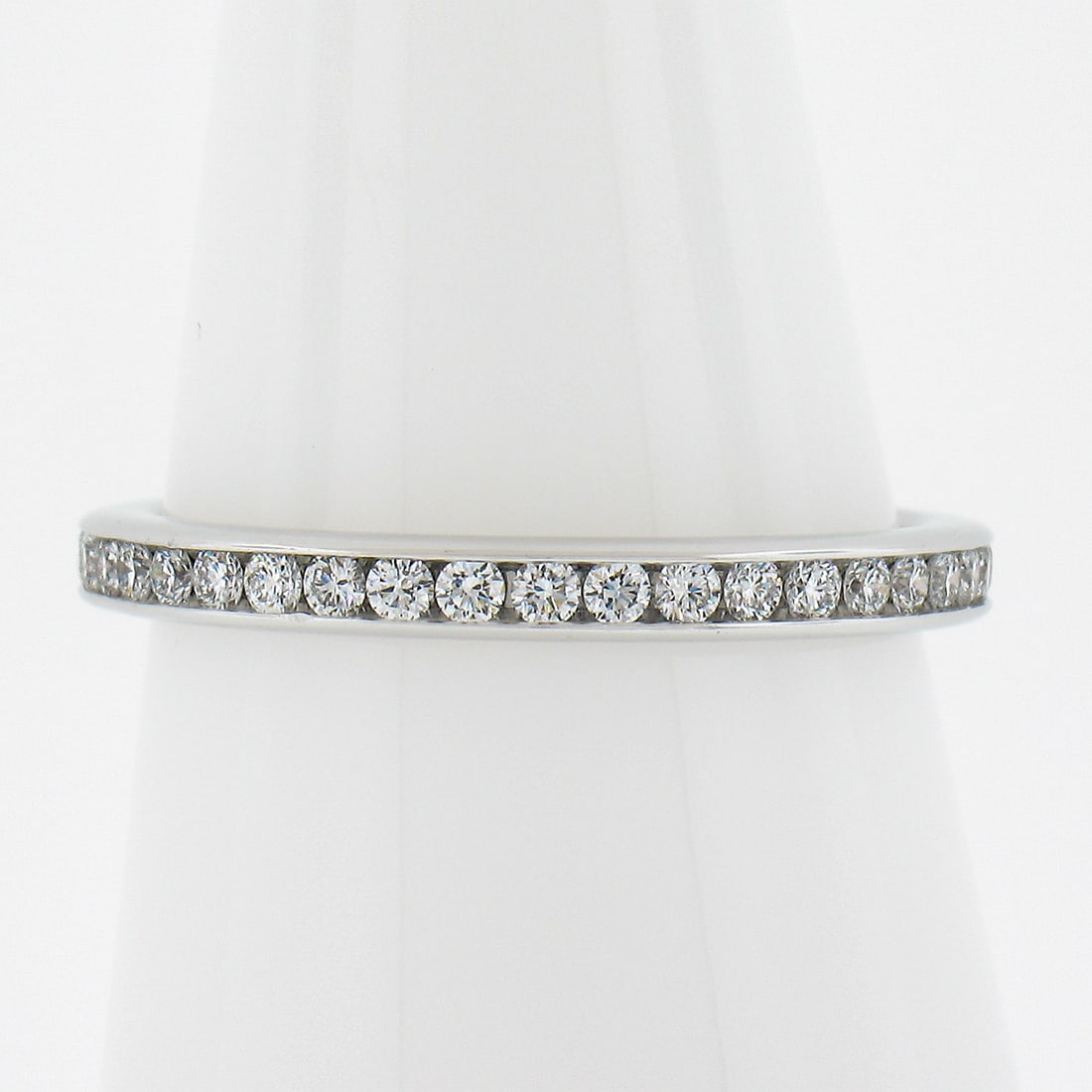 Tiffany & Co. Platinum 0.50ct Channel Set Diamond Eternity Wedding Band: Tiffany & Co. Platinum 0.50ct Channel Set Diamond Eternity Wedding Band This exquisite Tiffany & Co. wedding band ring showcases a channel-set design featuring 40 round brilliant cut diamonds with a t
