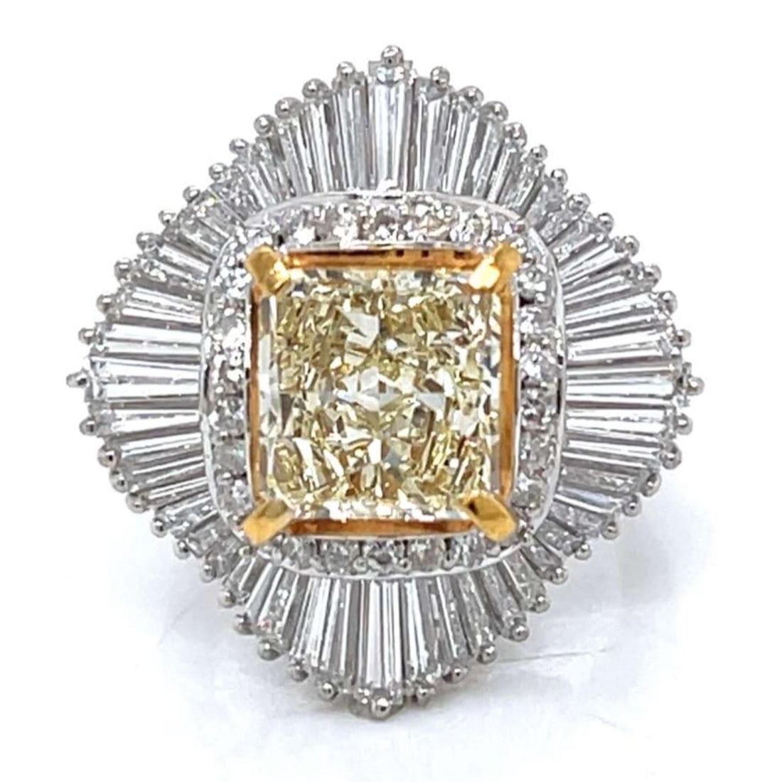 3.03 Ct Fancy Yellow Diamond Platinum Ring with EGL Laser Engraving: 3.03 Ct Fancy Yellow Diamond Platinum Ring with EGL Laser Engraving This platinum ring features an EGL laser-engraved 3.03 carat fancy yellow diamond with VS1 clarity at its center. Accenting the cent