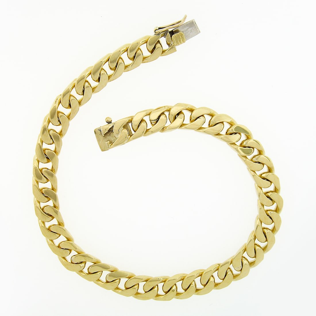 Men's 18k Solid Yellow Gold 7.3mm Cuban Curb Link Bracelet 8.25": Men's 18k Solid Yellow Gold 7.3mm Cuban Curb Link Bracelet 8.25" This exquisite Men's Solid Yellow Gold Cuban Curb Link Chain Bracelet is crafted from solid 18k yellow gold, featuring a polished finis