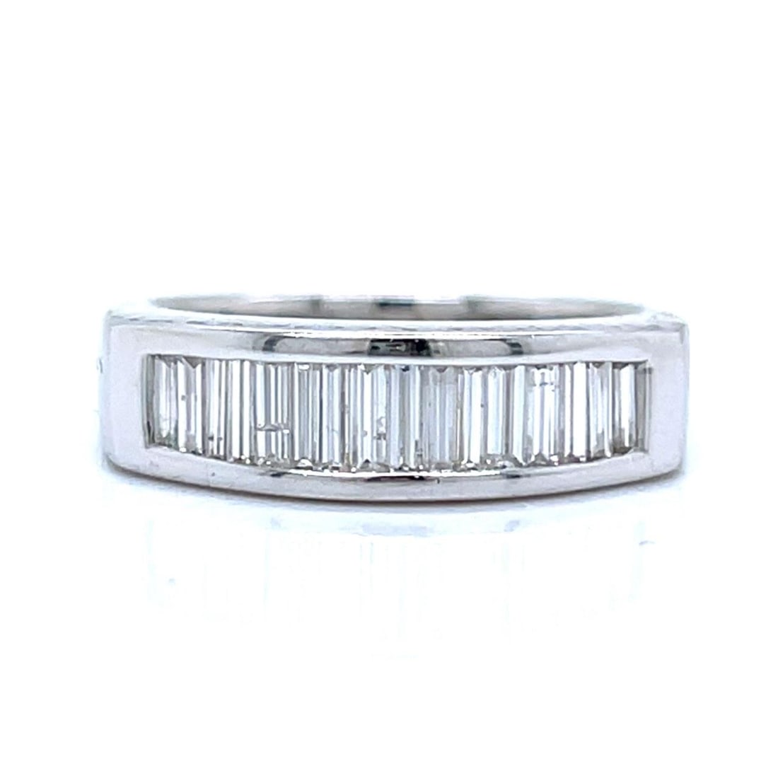 Sixteen Baguette Diamond Ring in 18K White Gold 1.00 Carat: Sixteen Baguette Diamond Ring in 18K White Gold 1.00 Carat This elegant anniversary band is crafted in 18K white gold and features 16 baguette diamonds with a total weight of approximately 1.00 carat.