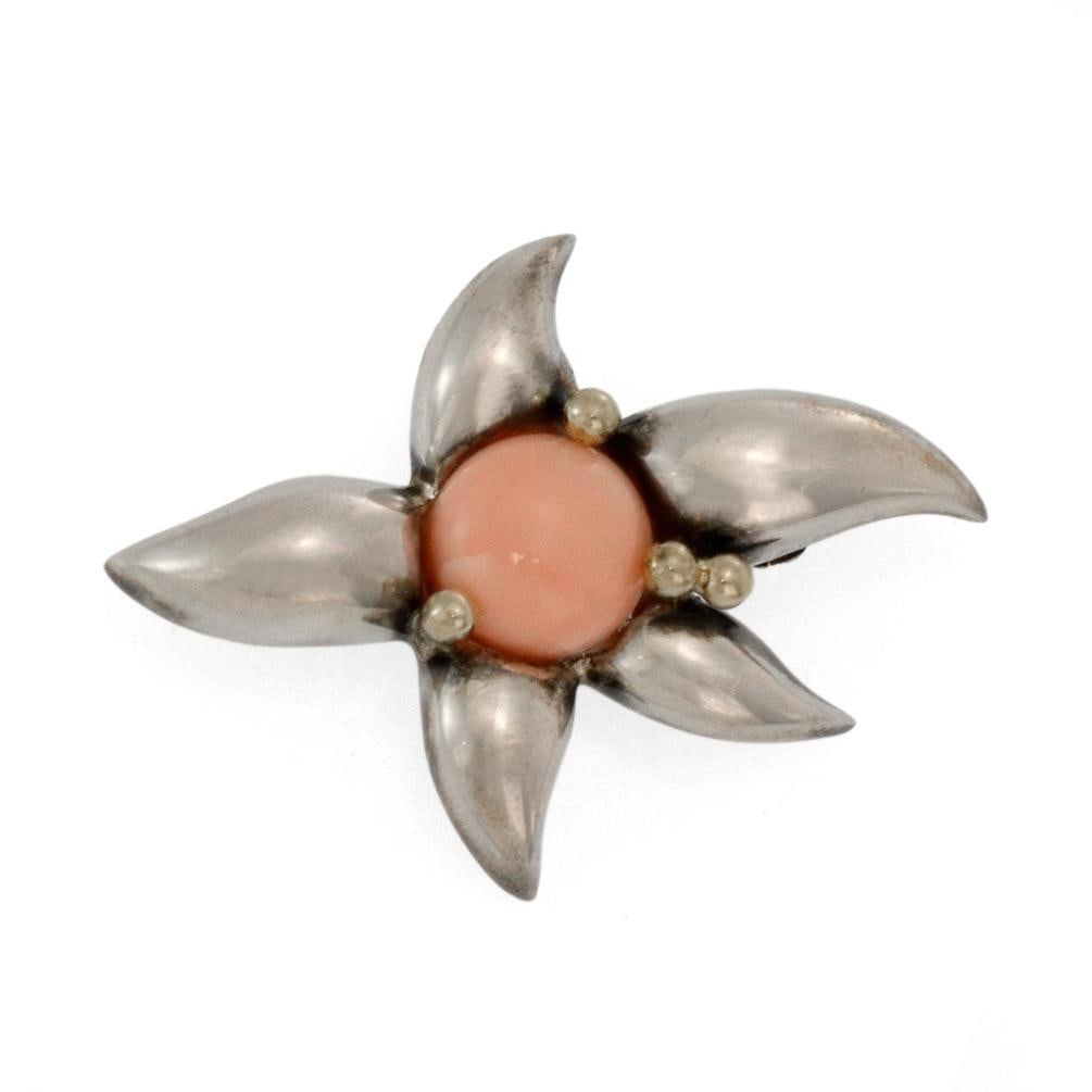Tiffany & Co. Fireworks Vintage Brooch Coral 18k Gold Silver 1993: Tiffany & Co. Fireworks Vintage Brooch Coral 18k Gold Silver 1993 This exquisite vintage brooch from Tiffany & Co. is part of the celebrated FIREWORKS collection, crafted in 1993. This piece features