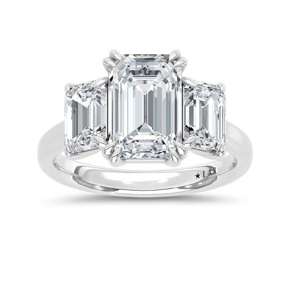 14K White Gold Lab Grown Diamond 5 Ct.Tw. Emerald Cut Three Stone Engagement Ring: 14K White Gold Lab Grown Diamond 5 Ct.Tw. Emerald Cut Three Stone Engagement Ring This stunning three-stone ring features a sparkling 3 CT Emerald Center diamond with two shimmering side diamonds, sym