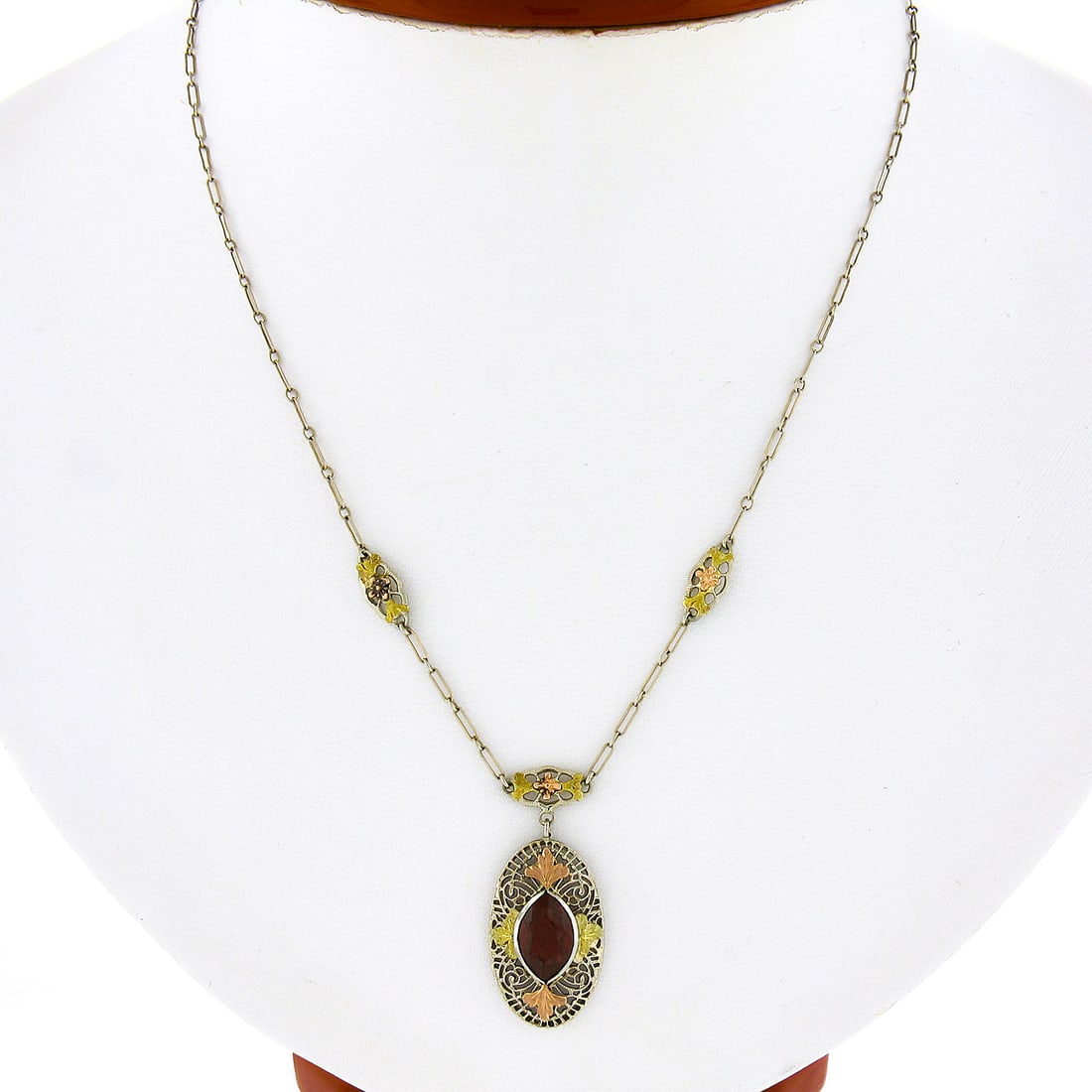 Antique Art Deco 14k Multicolor Gold Garnet Pendant Necklace: Antique Art Deco 14k Multicolor Gold Garnet Pendant Necklace This stunning antique Art Deco pendant necklace showcases exquisite craftsmanship in solid 14k tri-color gold, featuring green, rose, and w