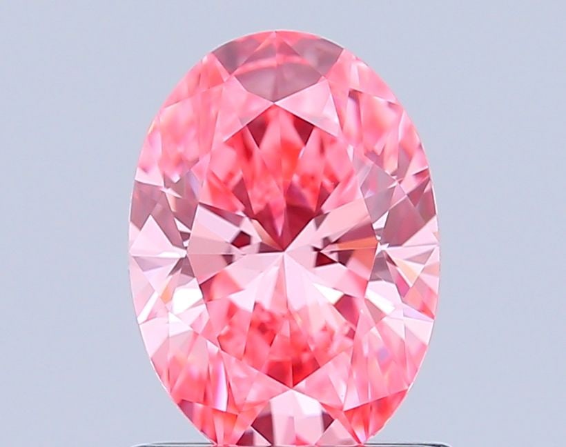 Loose Diamond - OVAL 1.02ct Fancy Vivid Pink VVS2: Loose Diamond - OVAL 1.02ct Fancy Vivid Pink VVS2 Source: This is a real non-mined Diamond that has been grown in a lab Shape: OVAL Carats: 1.02 Color: Fancy Vivid Pink Certification: IGI Video: