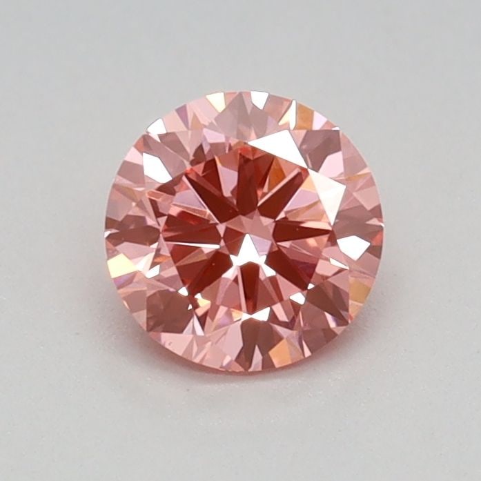Loose Diamond - ROUND 0.43ct Fancy Vivid Pink VVS2: Loose Diamond - ROUND 0.43ct Fancy Vivid Pink VVS2 Source: This is a real non-mined Diamond that has been grown in a lab Shape: ROUND Carats: 0.43 Color: Fancy Vivid Pink Certification: IGI Video: