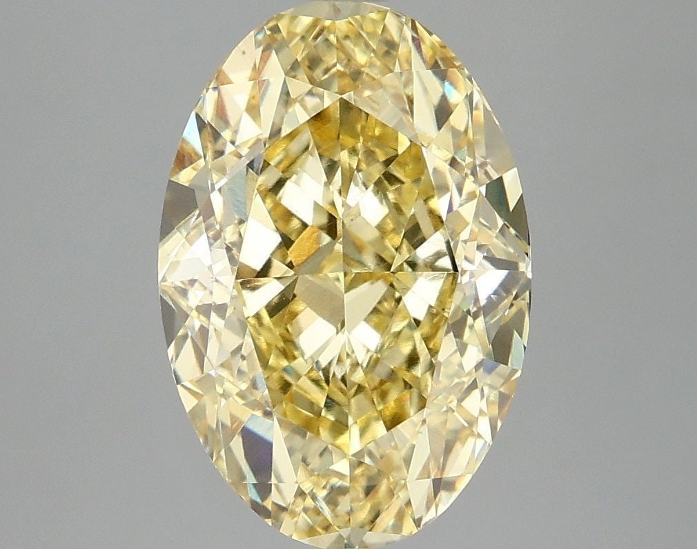 Loose Diamond - OVAL 4.07ct Fancy Vivid Yellow VS1: Loose Diamond - OVAL 4.07ct Fancy Vivid Yellow VS1 Source: This is a real non-mined Diamond that has been grown in a lab Shape: OVAL Carats: 4.07 Color: Fancy Vivid Yellow Certification: IGI Video: