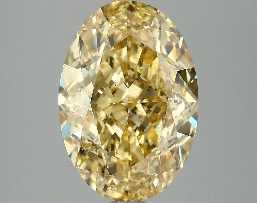 Loose Diamond - OVAL 4.14ct Fancy Vivid Yellow VS1: Loose Diamond - OVAL 4.14ct Fancy Vivid Yellow VS1 Source: This is a real non-mined Diamond that has been grown in a lab Shape: OVAL Carats: 4.14 Color: Fancy Vivid Yellow Certification: IGI Video:
