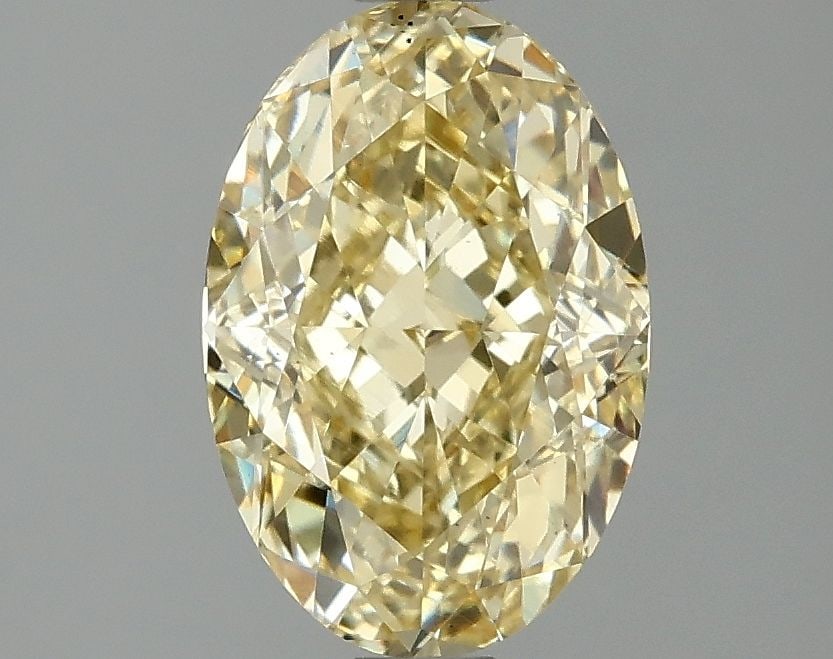 Loose Diamond - OVAL 2.07ct Fancy Vivid Yellow VS2: Loose Diamond - OVAL 2.07ct Fancy Vivid Yellow VS2 Source: This is a real non-mined Diamond that has been grown in a lab Shape: OVAL Carats: 2.07 Color: Fancy Vivid Yellow Certification: IGI Video: