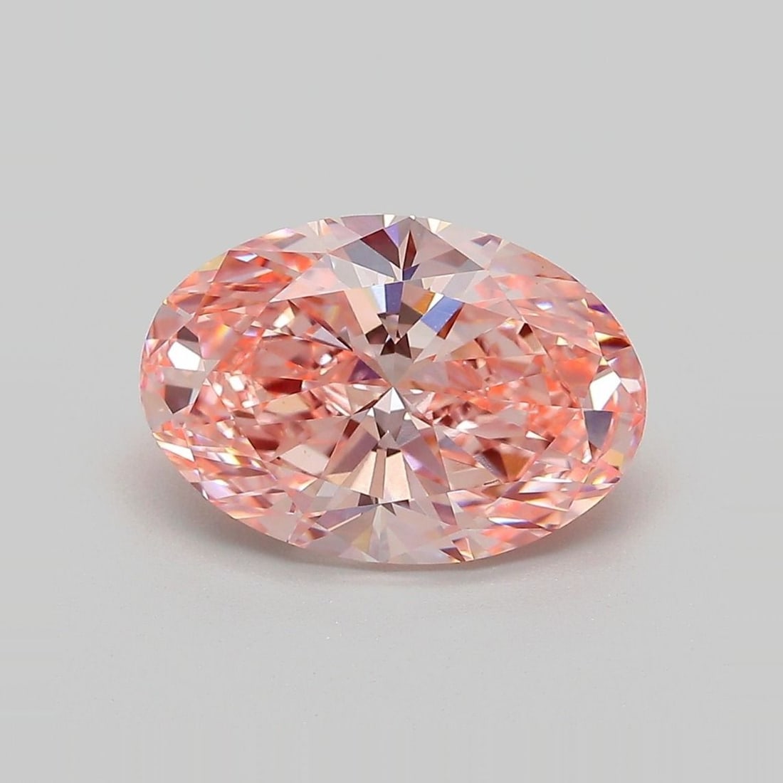 Loose Diamond - OVAL 3.52ct Fancy Vivid Pink VVS2: Loose Diamond - OVAL 3.52ct Fancy Vivid Pink VVS2 Source: This is a real non-mined Diamond that has been grown in a lab Shape: OVAL Carats: 3.52 Color: Fancy Vivid Pink Certification: IGI Video: