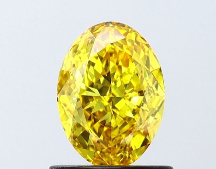 Loose Diamond - OVAL 0.91ct Fancy Vivid Yellow VS2: Loose Diamond - OVAL 0.91ct Fancy Vivid Yellow VS2 Source: This is a real non-mined Diamond that has been grown in a lab Shape: OVAL Carats: 0.91 Color: Fancy Vivid Yellow Certification: IGI Video: