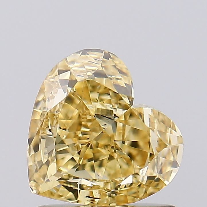 Loose Diamond - HEART 1.08ct Fancy Intense Yellow VS2: Loose Diamond - HEART 1.08ct Fancy Intense Yellow VS2 Source: This is a real non-mined Diamond that has been grown in a lab Shape: HEART Carats: 1.08 Color: Fancy Intense Yellow Certification: IGI Vid