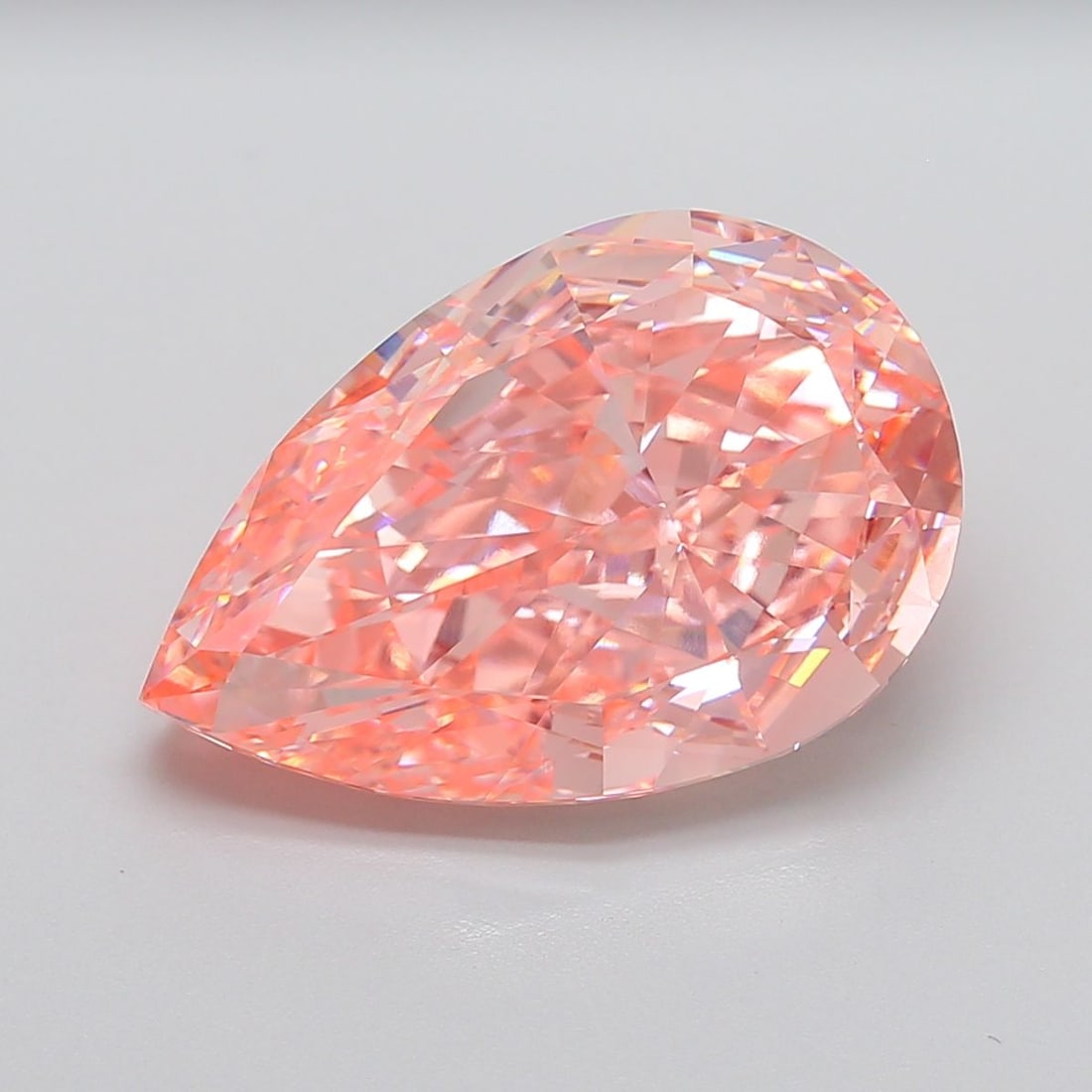 Loose Diamond - PEAR 13.01ct Fancy Vivid Pink VVS2: Loose Diamond - PEAR 13.01ct Fancy Vivid Pink VVS2 Source: This is a real non-mined Diamond that has been grown in a lab Shape: PEAR Carats: 13.01 Color: Fancy Vivid Pink Certification: IGI Video: