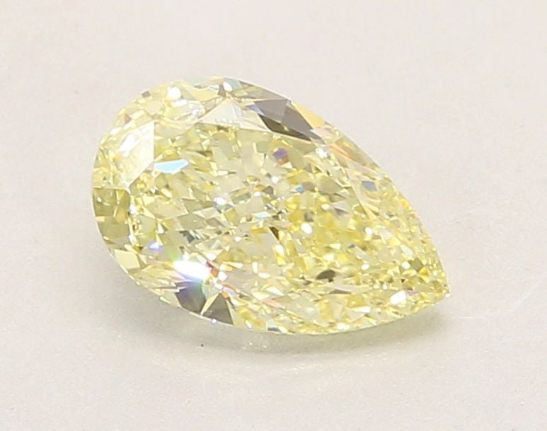 Loose Diamond - PEAR 1.38ct Fancy Yellow VVS2: Loose Diamond - PEAR 1.38ct Fancy Yellow VVS2 Source: This is a real non-mined Diamond that has been grown in a lab Shape: PEAR Carats: 1.38 Color: Fancy Yellow Certification: IGI Video: