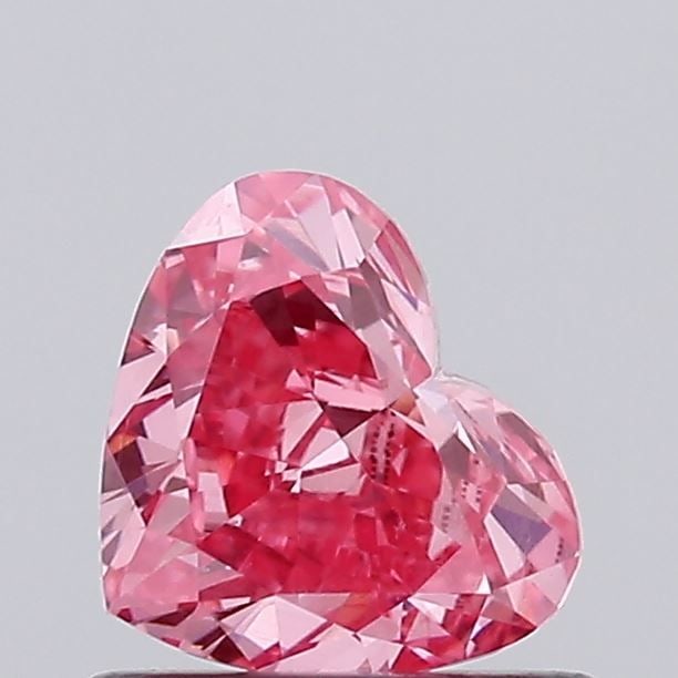 Loose Diamond - HEART 0.71ct Fancy Vivid Pink VS1: Loose Diamond - HEART 0.71ct Fancy Vivid Pink VS1 Source: This is a real non-mined Diamond that has been grown in a lab Shape: HEART Carats: 0.71 Color: Fancy Vivid Pink Certification: IGI Video: