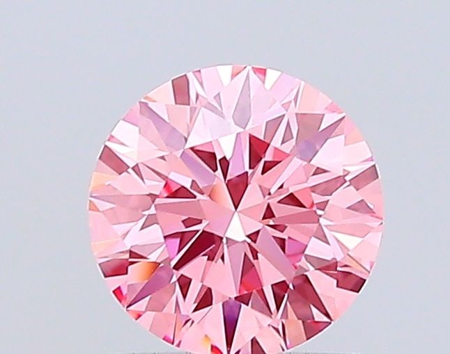 Ideal Loose Diamond - ROUND 1.07ct Fancy Vivid Pink VVS2: Ideal Loose Diamond - ROUND 1.07ct Fancy Vivid Pink VVS2 Source: This is a real non-mined Diamond that has been grown in a lab Shape: ROUND Carats: 1.07 Color: Fancy Vivid Pink Certification: IGI Vide