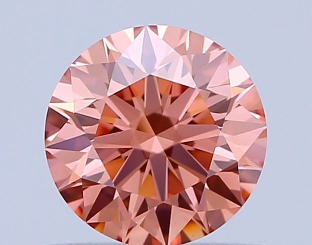 Ideal Loose Diamond - ROUND 0.73ct Fancy Vivid Pink VVS2: Ideal Loose Diamond - ROUND 0.73ct Fancy Vivid Pink VVS2 Source: This is a real non-mined Diamond that has been grown in a lab Shape: ROUND Carats: 0.73 Color: Fancy Vivid Pink Certification: IGI