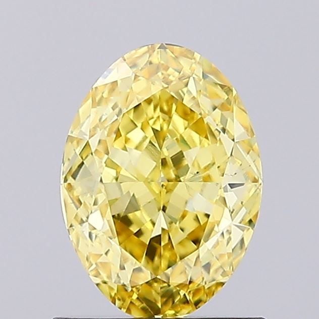 Loose Diamond - OVAL 1.11ct Fancy Vivid Yellow VS1: Loose Diamond - OVAL 1.11ct Fancy Vivid Yellow VS1 Source: This is a real non-mined Diamond that has been grown in a lab Shape: OVAL Carats: 1.11 Color: Fancy Vivid Yellow Certification: IGI Video: