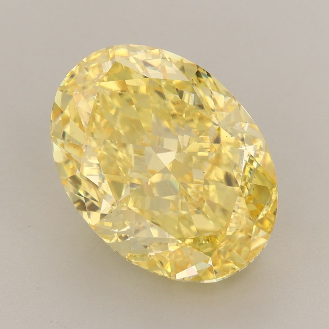 Loose Diamond - OVAL 7.94ct Fancy Vivid Yellow VS1: Loose Diamond - OVAL 7.94ct Fancy Vivid Yellow VS1 Source: This is a real non-mined Diamond that has been grown in a lab Shape: OVAL Carats: 7.94 Color: Fancy Vivid Yellow Certification: IGI Video: