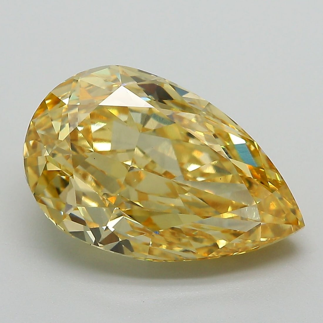 Loose Diamond - PEAR 7.18ct Fancy Vivid Yellow VS1: Loose Diamond - PEAR 7.18ct Fancy Vivid Yellow VS1 Source: This is a real non-mined Diamond that has been grown in a lab Shape: PEAR Carats: 7.18 Color: Fancy Vivid Yellow Certification: IGI Video: