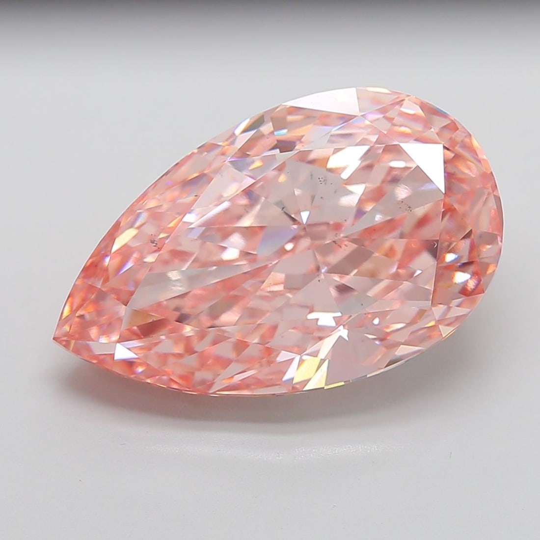 Loose Diamond - PEAR 21.12ct Fancy Vivid Pink VS2: Loose Diamond - PEAR 21.12ct Fancy Vivid Pink VS2 Source: This is a real non-mined Diamond that has been grown in a lab Shape: PEAR Carats: 21.12 Color: Fancy Vivid Pink Certification: IGI Video: