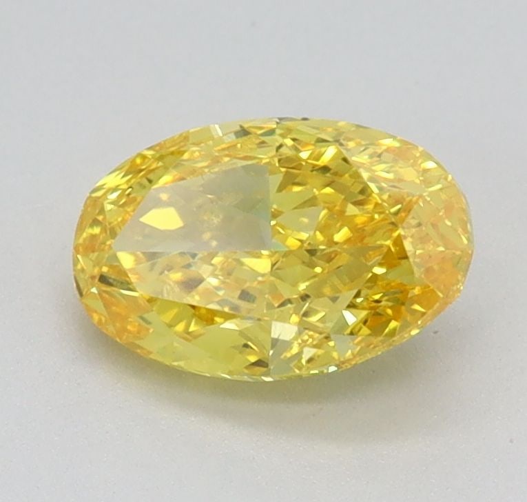 Loose Diamond - OVAL 0.79ct Fancy Vivid Yellow VVS2: Loose Diamond - OVAL 0.79ct Fancy Vivid Yellow VVS2 Source: This is a real non-mined Diamond that has been grown in a lab Shape: OVAL Carats: 0.79 Color: Fancy Vivid Yellow Certification: IGI Video: