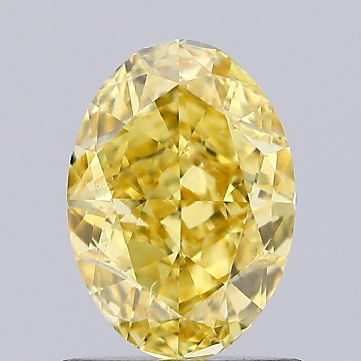 Loose Diamond - OVAL 0.99ct Fancy Vivid Yellow VS2: Loose Diamond - OVAL 0.99ct Fancy Vivid Yellow VS2 Source: This is a real non-mined Diamond that has been grown in a lab Shape: OVAL Carats: 0.99 Color: Fancy Vivid Yellow Certification: IGI Video: