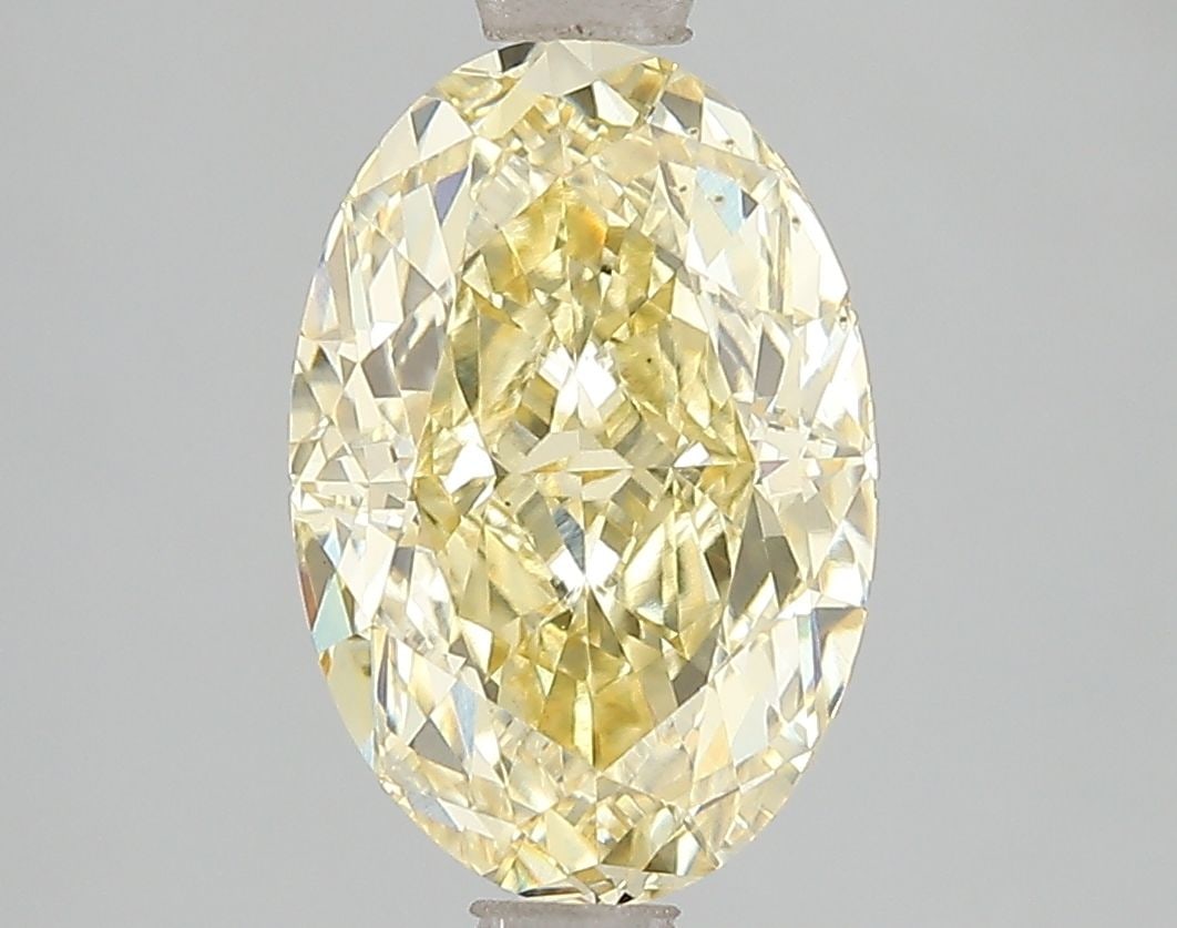 Loose Diamond - OVAL 3.05ct Fancy Vivid Yellow VS2: Loose Diamond - OVAL 3.05ct Fancy Vivid Yellow VS2 Source: This is a real non-mined Diamond that has been grown in a lab Shape: OVAL Carats: 3.05 Color: Fancy Vivid Yellow Certification: IGI Video: