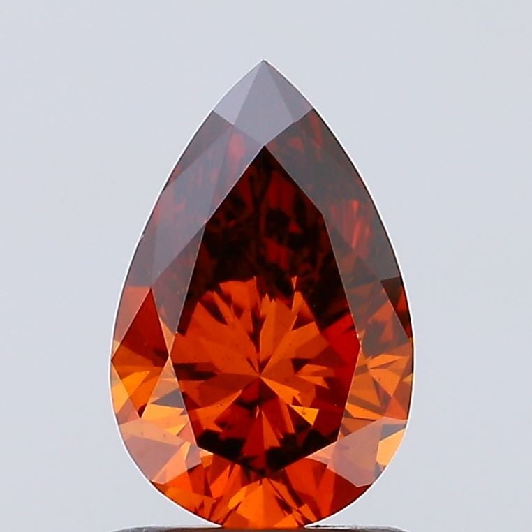 Loose Diamond - PEAR 1.0ct Fancy Vivid Brownish Orange VS2: Loose Diamond - PEAR 1.0ct Fancy Vivid Brownish Orange VS2 Source: This is a real non-mined Diamond that has been grown in a lab Shape: PEAR Carats: 1.0 Color: Fancy Vivid Brownish Orange Certificatio