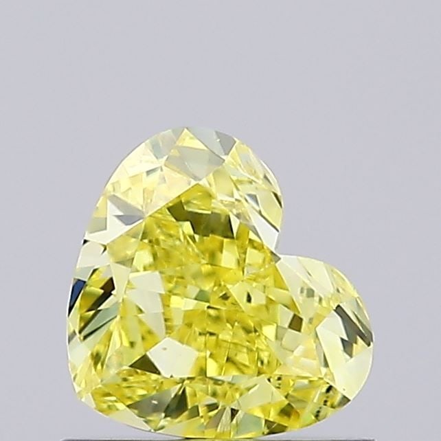 Loose Diamond - HEART 0.7ct Fancy Vivid Yellow VS2: Loose Diamond - HEART 0.7ct Fancy Vivid Yellow VS2 Source: This is a real non-mined Diamond that has been grown in a lab Shape: HEART Carats: 0.7 Color: Fancy Vivid Yellow Certification: IGI Video: