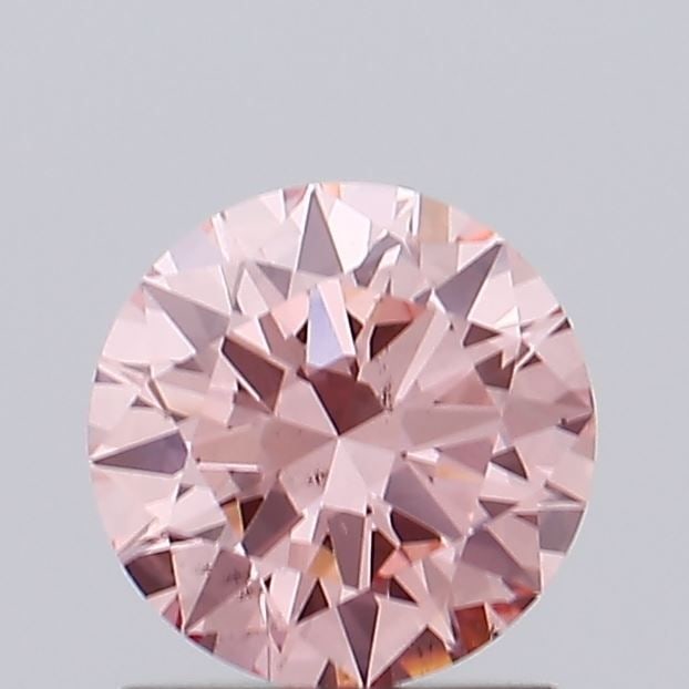 Loose Diamond - ROUND 0.91ct Fancy Vivid Pink VS2: Loose Diamond - ROUND 0.91ct Fancy Vivid Pink VS2 Source: This is a real non-mined Diamond that has been grown in a lab Shape: ROUND Carats: 0.91 Color: Fancy Vivid Pink Certification: IGI Video: