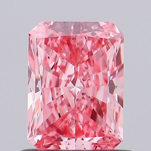 Loose Diamond - RADIANT 0.66ct Fancy Vivid Pink VS2: Loose Diamond - RADIANT 0.66ct Fancy Vivid Pink VS2 Source: This is a real non-mined Diamond that has been grown in a lab Shape: RADIANT Carats: 0.66 Color: Fancy Vivid Pink Certification: IGI Video: