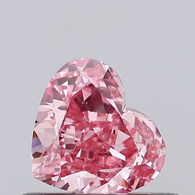 Loose Diamond - HEART 0.46ct Fancy Vivid Pink VS1: Loose Diamond - HEART 0.46ct Fancy Vivid Pink VS1 Source: This is a real non-mined Diamond that has been grown in a lab Shape: HEART Carats: 0.46 Color: Fancy Vivid Pink Certification: IGI Video: