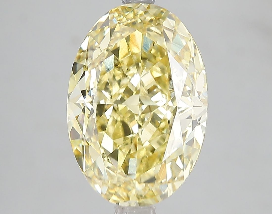 Loose Diamond - OVAL 5.01ct Fancy Vivid Yellow SI1: Loose Diamond - OVAL 5.01ct Fancy Vivid Yellow SI1 Source: This is a real non-mined Diamond that has been grown in a lab Shape: OVAL Carats: 5.01 Color: Fancy Vivid Yellow Certification: IGI Video: