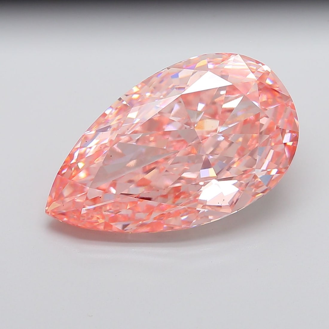 Loose Diamond - PEAR 21.1ct Fancy Vivid Pink VS1: Loose Diamond - PEAR 21.1ct Fancy Vivid Pink VS1 Source: This is a real non-mined Diamond that has been grown in a lab Shape: PEAR Carats: 21.1 Color: Fancy Vivid Pink Certification: IGI Video:
