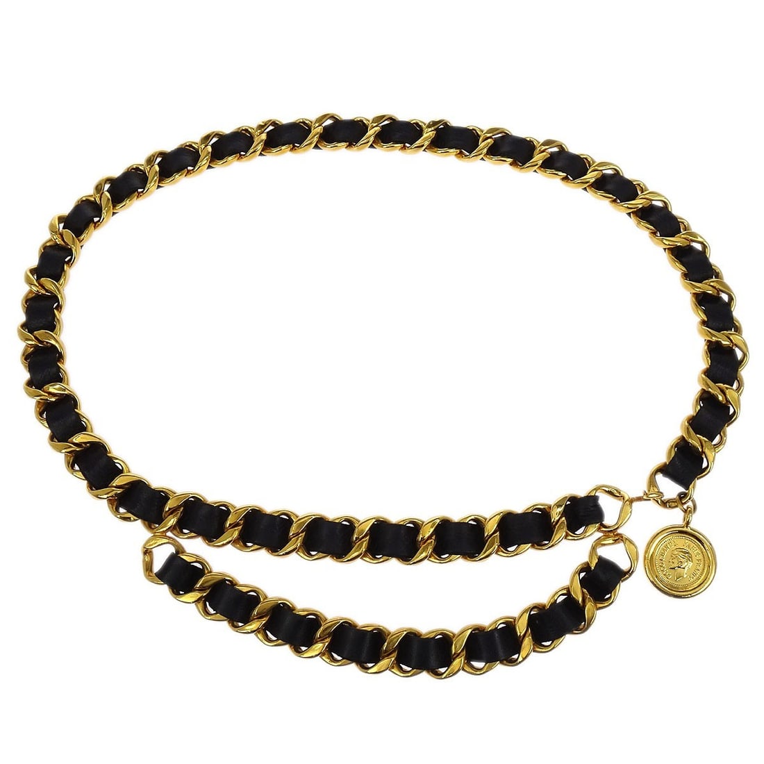 Small Gold and Black Medallion Chain Belt by Chanel: Small Gold and Black Medallion Chain Belt by Chanel This Chanel chain belt features a medallion design in gold and black. Made in France, it is a stylish accessory that adds a sophisticated touch to y