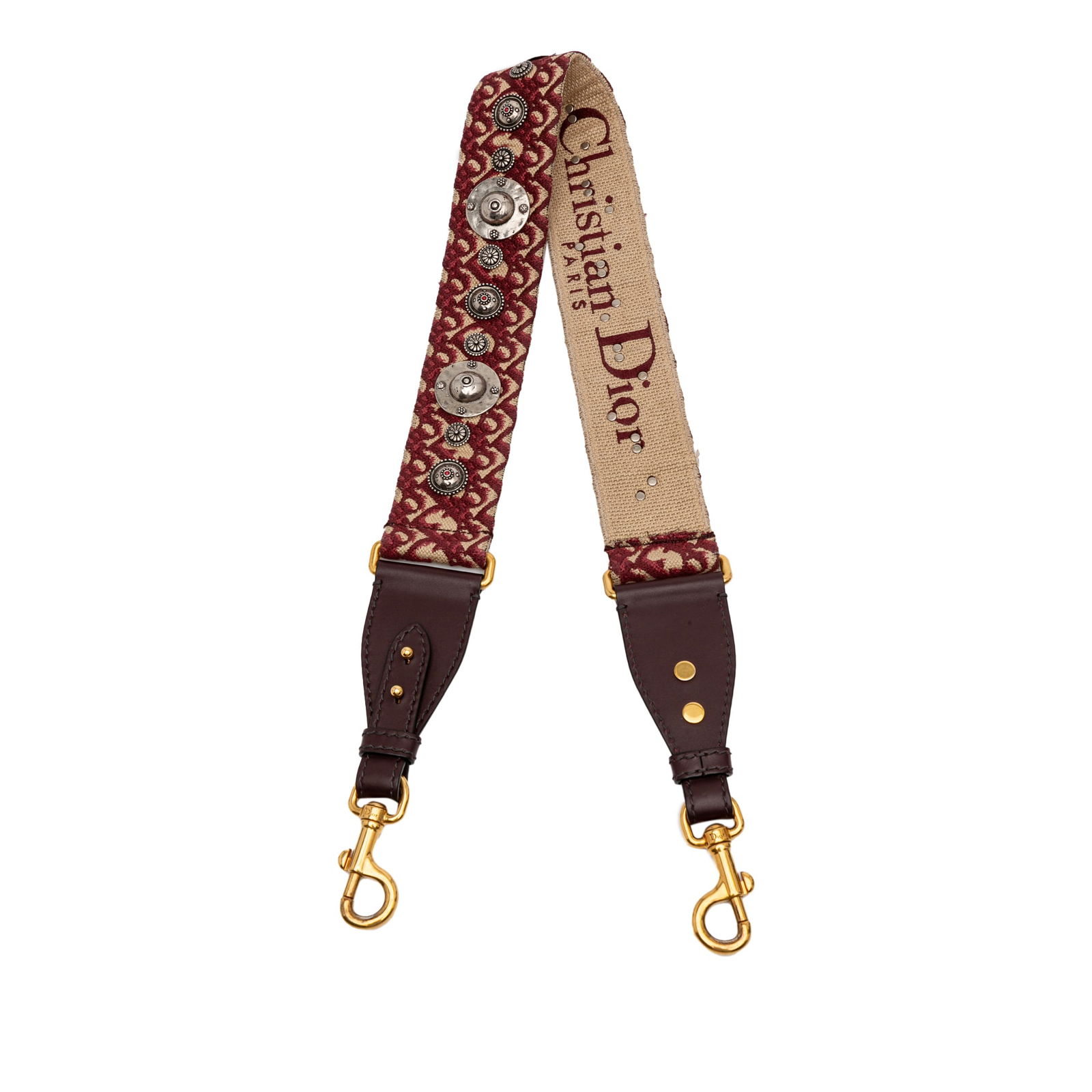 Dior Red Studded Oblique Canvas Bag Strap Italy: Dior Red Studded Oblique Canvas Bag Strap Italy Elevate your accessory collection with the Dior Studded Oblique Canvas Bag Strap. This stylish shoulder strap features a striking studded canvas design