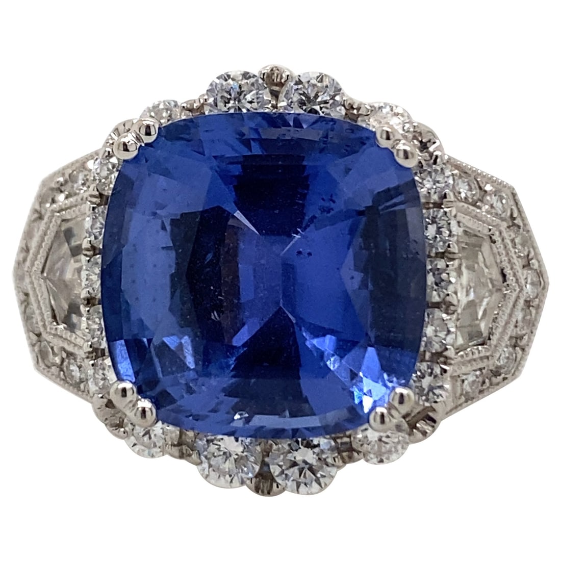 Art Deco 8.11ct Sapphire Diamond Ring in 18k White Gold: Art Deco 8.11ct Sapphire Diamond Ring in 18k White Gold This stunning Art Deco style ring features an exquisite 8.11 carat cushion-cut sapphire at its center, complemented by 1.54 carats of brilliant