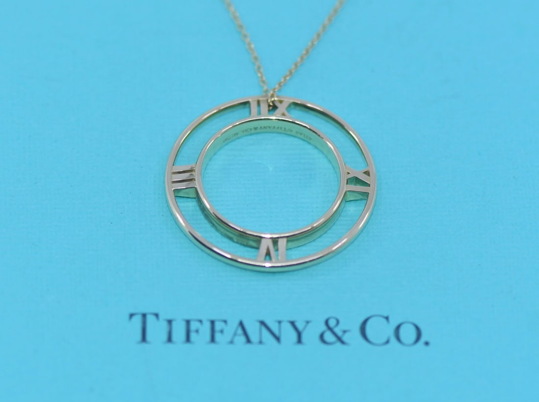 Tiffany & Co Atlas 18K Yellow Gold Pendant Necklace with Box: Tiffany & Co Atlas 18K Yellow Gold Pendant Necklace with Box This elegant Tiffany & Co. Atlas necklace features a stunning pendant crafted from 18K yellow gold. The necklace measures 18 inches in leng