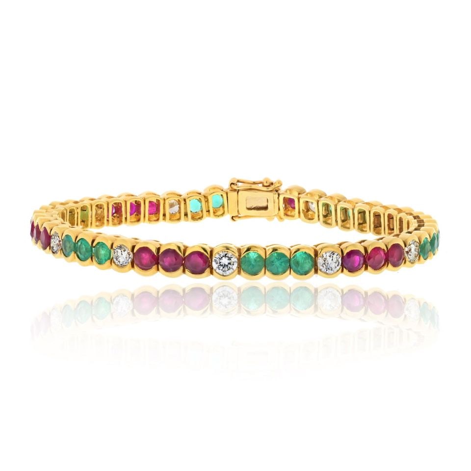 18K Yellow Gold Tennis Bracelet with Diamonds Rubies Emeralds 7 Inch: 18K Yellow Gold Tennis Bracelet with Diamonds Rubies Emeralds 7 Inch This stunning 18K Yellow Gold Tennis Bracelet features a luxurious combination of diamonds, emeralds, and rubies, making it a perfe