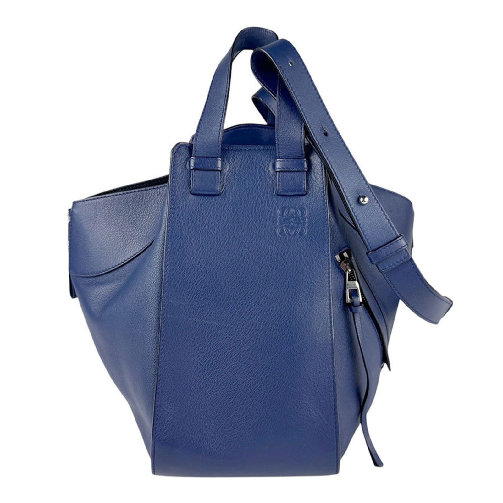 Blue Leather Hammock Shoulder Bag by Loewe: Blue Leather Hammock Shoulder Bag by Loewe The Loewe Hammock handbag is crafted from blue leather and features a versatile and contemporary design. Made in Spain, this bag showcases a spacious interio