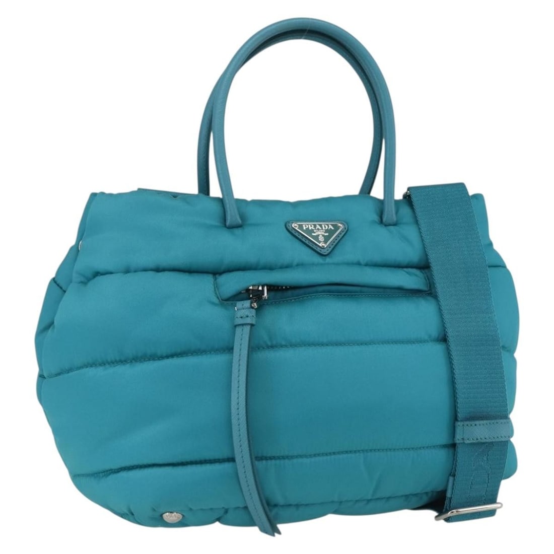 Prada Turquoise Nylon Bomber Handbag with Shoulder Strap and Dust Bag: Prada Turquoise Nylon Bomber Handbag with Shoulder Strap and Dust Bag This authentic PRADA Bomber 2-way hand bag features a stylish turquoise blue and silver color scheme with durable nylon exterior.