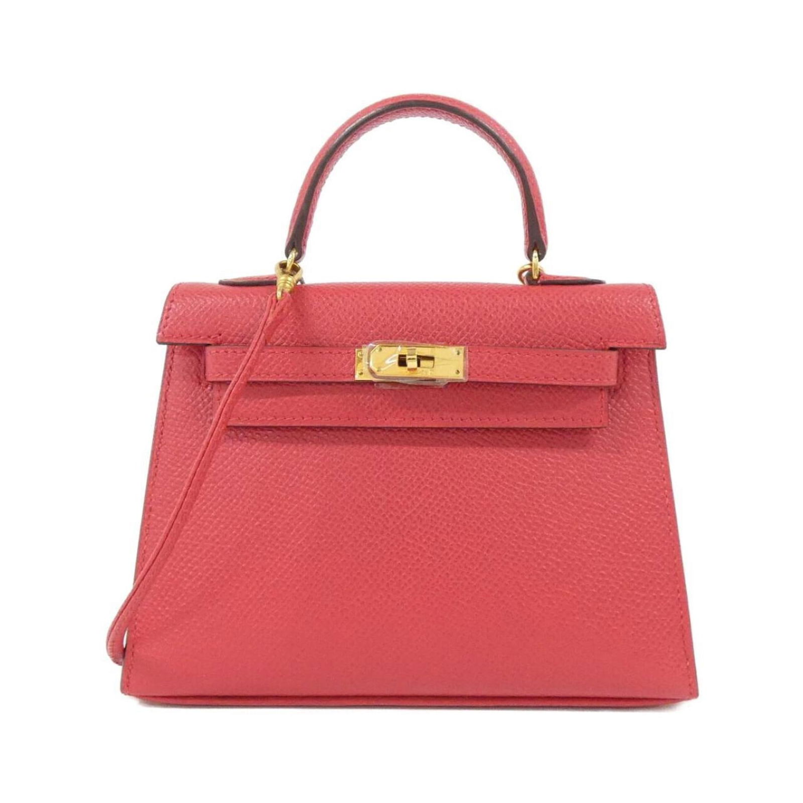 Red Leather Hermes Kelly Handbag 11cm by 15cm: Red Leather Hermes Kelly Handbag 11cm by 15cm This Hermes Kelly bag features a classic red leather design, crafted for women. The bag showcases the iconic Kelly silhouette and is made in France. It is