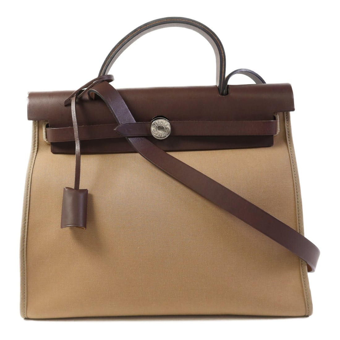 HERMES Herbag PM 2 Way Shoulder Handbag Canvas Gray: HERMES Herbag PM 2 Way Shoulder Handbag Canvas Gray This elegant HERMES Herbag PM 2 Way Shoulder Handbag showcases a chic and versatile design, crafted from durable canvas in a sophisticated gray hue.