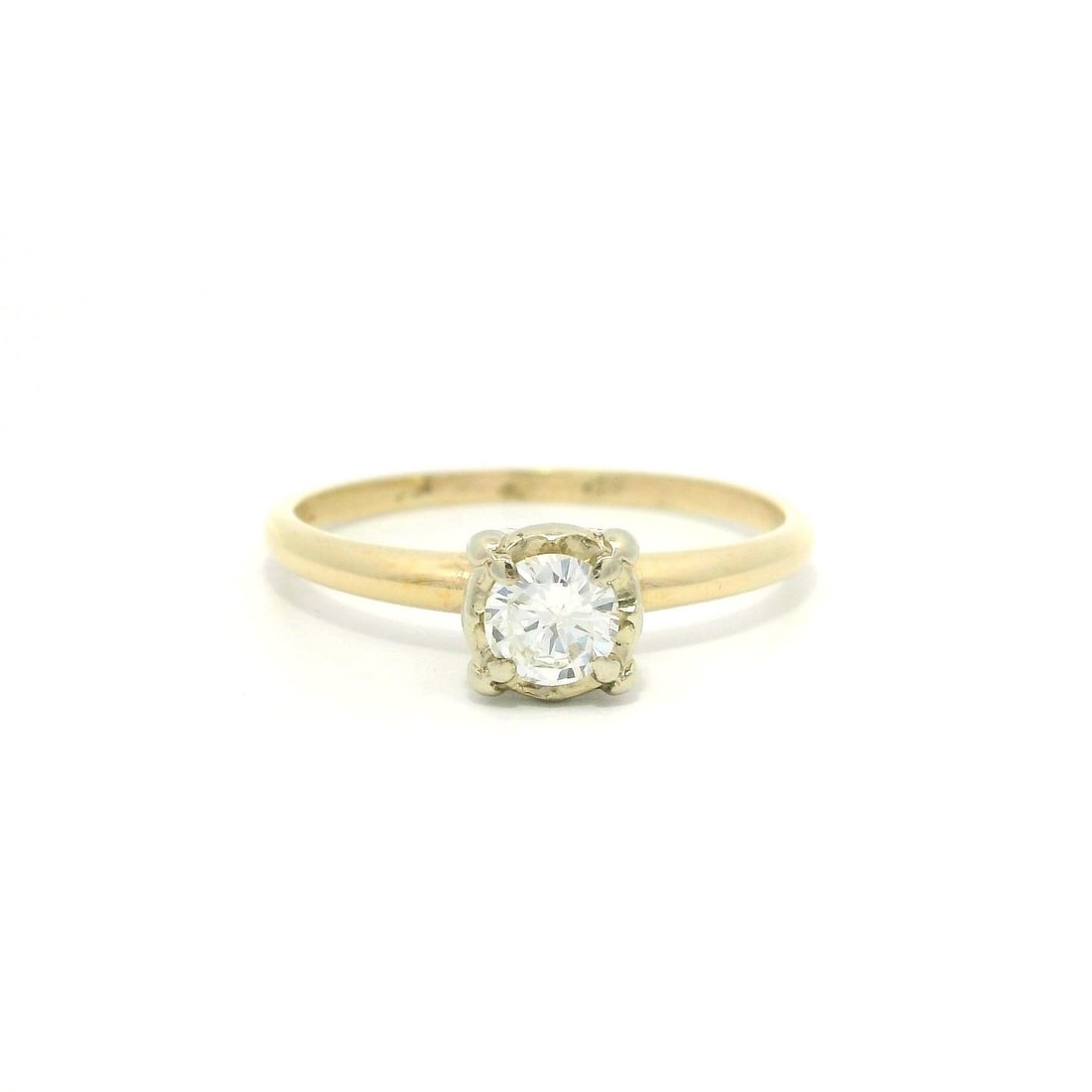 Vintage 14k Yellow Gold .35ct Illusion Diamond Solitaire Ring: Vintage 14k Yellow Gold .35ct Illusion Diamond Solitaire Ring This stunning vintage engagement ring features a .35ct round illusion diamond, artfully prong set in solid 14k yellow gold. The diamond ex