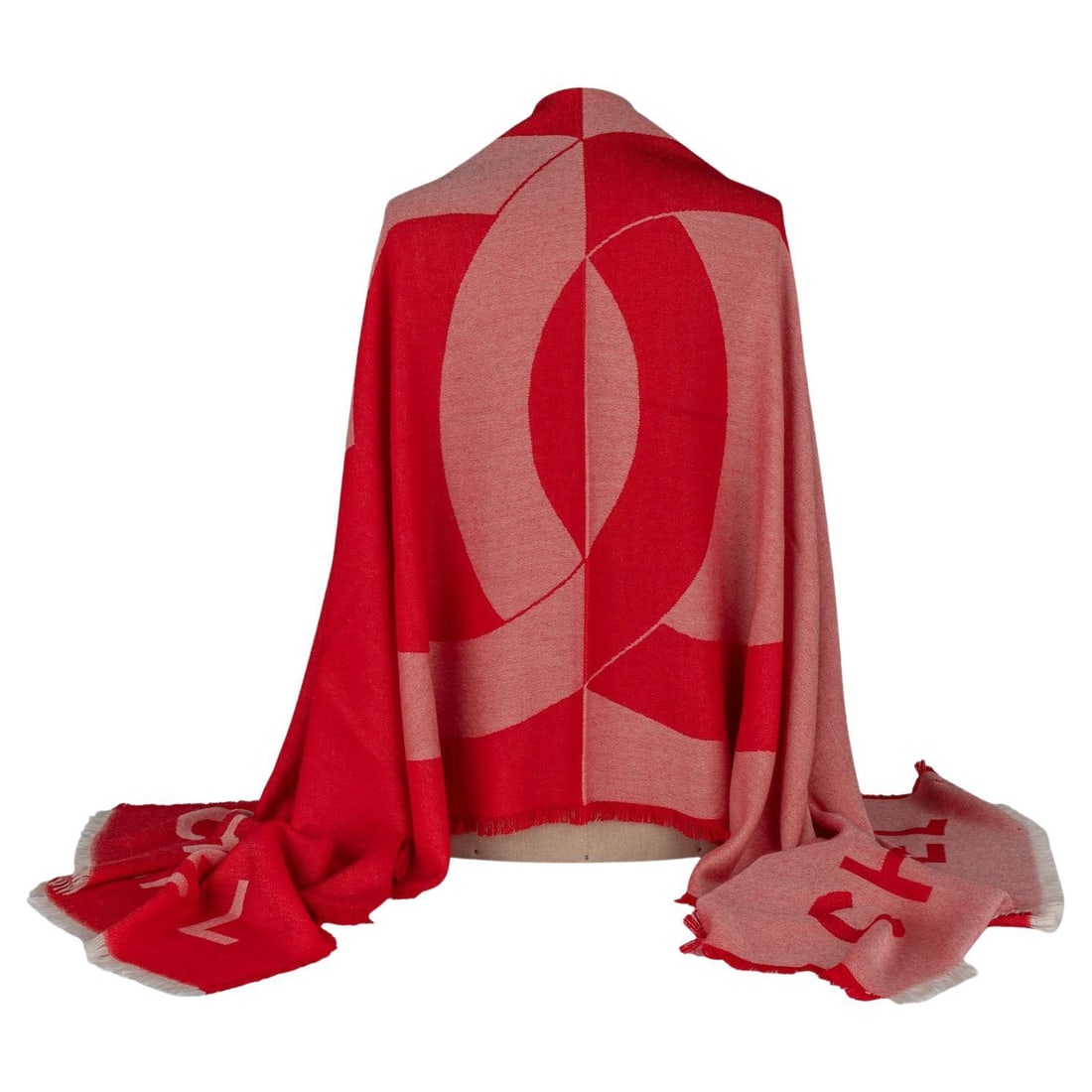 Chanel Red Cashmere Shawl with CC Logo Made in Italy: Chanel Red Cashmere Shawl with CC Logo Made in Italy Elevate your style with this exquisite Chanel Cashmere Shawl in a vibrant red hue. Crafted in Italy, this luxurious shawl features a prominent CC l