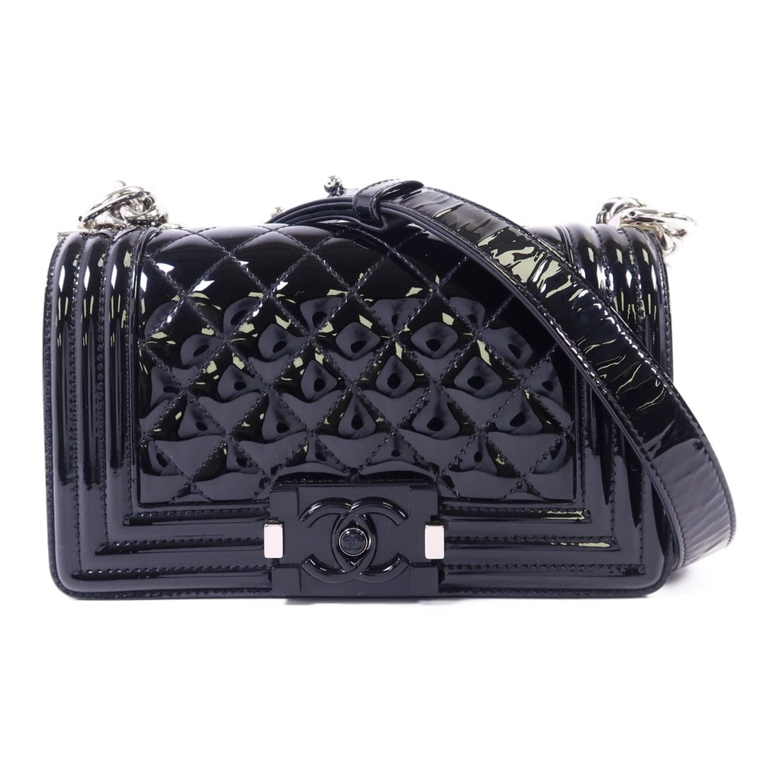 Chanel Boy 20 Black Patent Leather Shoulder Bag with Silver Hardware: Chanel Boy 20 Black Patent Leather Shoulder Bag with Silver Hardware This Chanel Boy 20 shoulder bag features a sleek black patent leather exterior and silver-tone hardware. The bag is designed with a