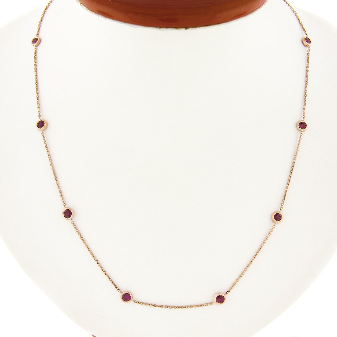 14k Handmade Rose Gold 2ctw Bezel Set Ruby Necklace 20" Adjustable Chain: 14k Handmade Rose Gold 2ctw Bezel Set Ruby Necklace 20" Adjustable Chain This exquisite necklace features a stunning arrangement of 10 round brilliant cut natural rubies, totaling approximately 2.00 c